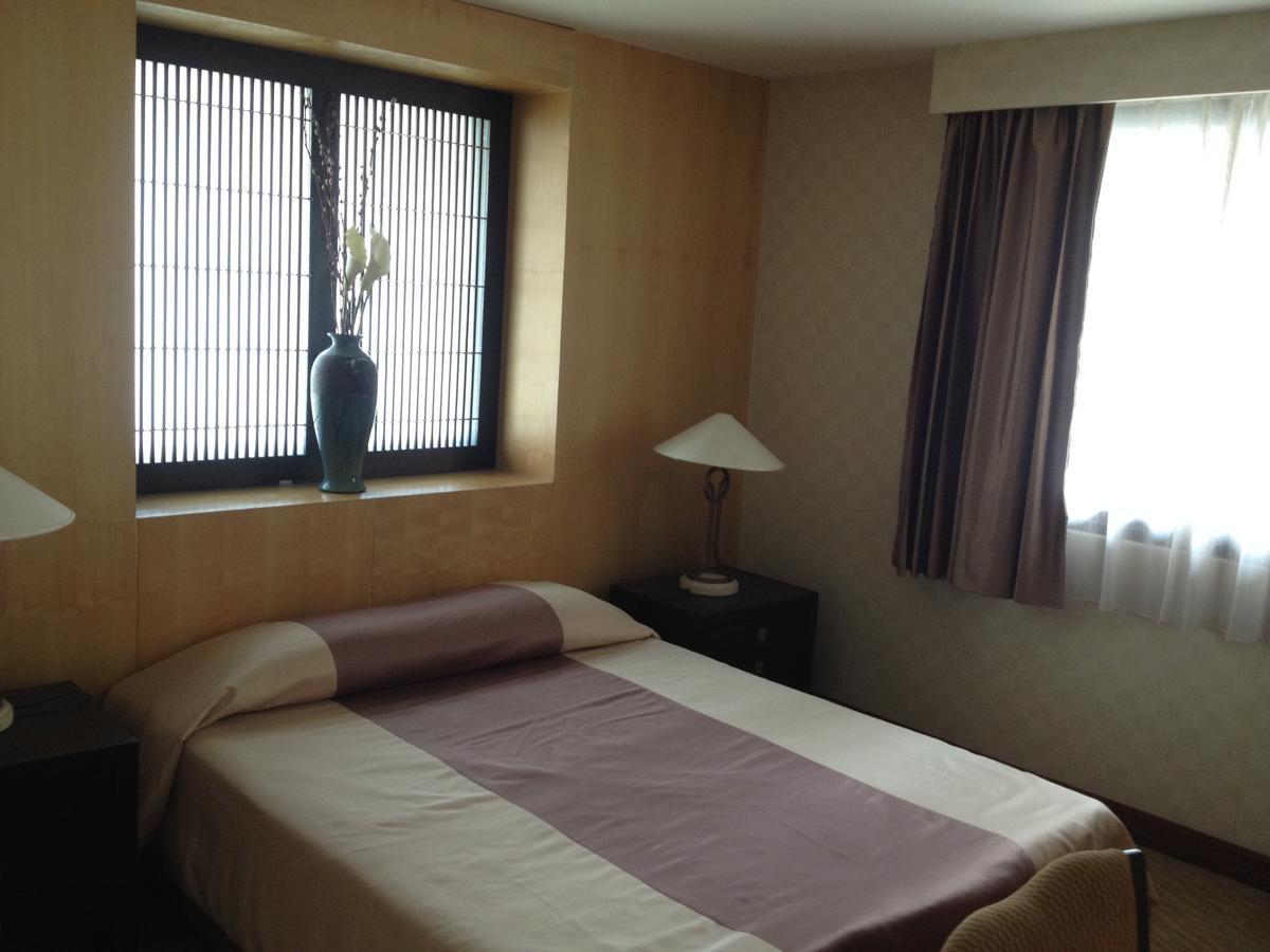 Gardengrove Suites Bangkok Rom bilde